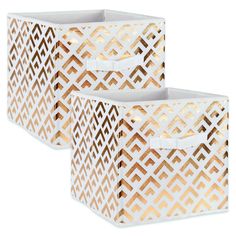 two white and gold storage bins with handles