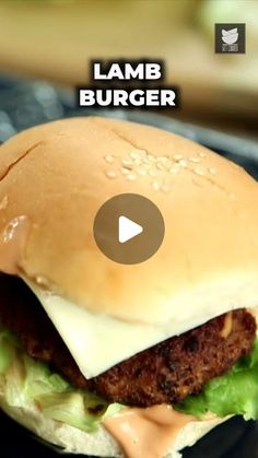 a hamburger with cheese and lettuce on it