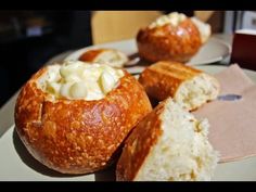 some bread rolls with cream cheese in them on a plate