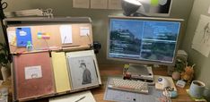 an open suitcase sitting on top of a desk next to a computer