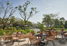 an outdoor dining area with tables and chairs