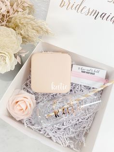 the bridesmaid gift box is filled with personalized items for her special day