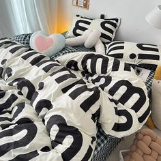 a bed with black and white letters on it