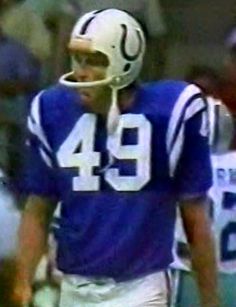 a close up of a football player wearing a helmet