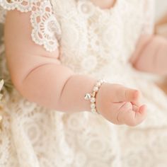 Handmade in the USA A sweet gift for your baby girl. When shopping for the perfect baby shower gift it will be difficult to find something else quite as classic as this white luster pearl bracelet with sterling silver heart charm. Arrives in an elegant laced lined metal box for a cute presentation. Also makes a perfect baptism or first birthday gift! White luster pearls Sterling silver heart charm **Please note that the bracelet should be worn under adult supervision and contains small parts** White Heart Beads Bracelet For Weddings, Heart-shaped Pearl Charm Bracelet For Wedding, Heart-shaped Pearl Bracelet For Wedding, Heart-shaped Pearl Bracelet With Charm For Wedding, Wedding Pearl Bracelet With Heart Beads, Wedding White Heart Beads Bracelets, Pearl Heart Bracelet For Wedding, Elegant Pearl Bracelet With Heart Beads For Wedding, White Heart-shaped Pearl Bracelet For Wedding