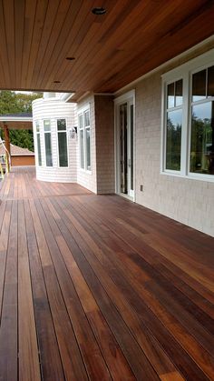 a wooden deck in front of a house