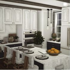 a large kitchen with white cabinets and black counter tops, an island in the middle has oranges on it