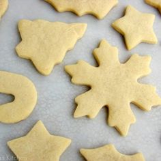 some cut out cookies sitting on top of a table