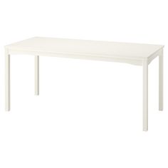 a white table sitting on top of a white floor