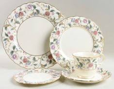 an assortment of porcelain plates and cups