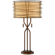 a lamp that is sitting on top of a wooden base and has a beige shade