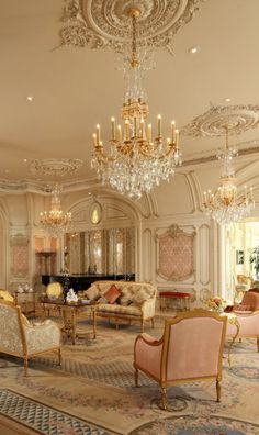 two pictures of fancy living room with chandeliers