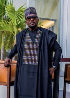 Step into a world of luxury and sophistication with our premium quality 100% cotton Agbada for men. Impeccably designed and tailored, this traditional suit comes in blue-black, adorned with intricate embroidery that showcases the beauty of Yoruba culture. Originating from Nigeria, West Africa, Agbada has long been associated with prestige and affluence among the Yoruba people. However, in today's fashion world, it has gained widespread popularity and has become a go-to attire for formal events, such as weddings, engagements, church services, African heritage parties, black history month celebrations, and other special occasions. Whether you're attending a traditional marriage or a black-tie event, our Agbada will make a bold statement and set you apart from the crowd. With its elegant and Agbada For Men, Yoruba Culture, Men African Wear, African Suit, Yoruba People, Traditional Suit, Unisex Clothes, African Clothing For Men, African Inspired Fashion