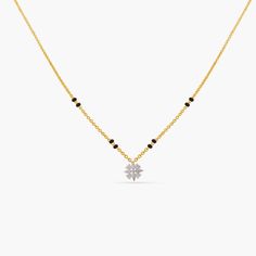 A picture of a gold plated silver chain with black beads and a flower pendant, featuring Cubic Zirconia on a white background. Mangalsutra Chain, Black Beads Mangalsutra, Black Beads Mangalsutra Design, Indian Wedding Bride, Gold Mangalsutra, Gold Mangalsutra Designs, Mangalsutra Designs, Indian Jewellery Design, 925 Silver Jewelry