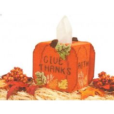 an orange box with the words glue thanks on it and some autumn decorations around it