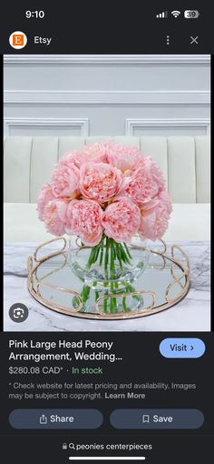 pink carnations in a glass vase on top of a table with an instagram