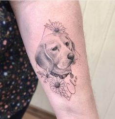 a woman with a dog tattoo on her arm