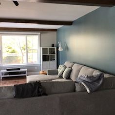 a living room filled with furniture and a flat screen tv