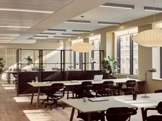 an empty office with desks and chairs