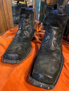 "Hand crafted in Italy. Vintage. Outrageously detailed kickers w/hobnail studded square toes, suede appliqués, incised rubber sole scenes  & distinctive  cerulean leather interior accents. The boots measure 12\" from 2\" heel to toe.  They are 4\" at widest point across sole.   They show just enuff wear to be taken seriously & are in premo hot-to-trot condition.  Priced accordingly." Black Moto Boots With Leather Sole For Western-themed Events, Black Snip Toe Boots For Festival, Black Snip Toe Festival Boots, Black Ankle Moto Boots For Western-themed Events, Custom Black Leather Boots, Vintage Black Moto Boots For Western-themed Events, Black Leather Moto Boots For Festival, Italy Vintage, Interior Accents