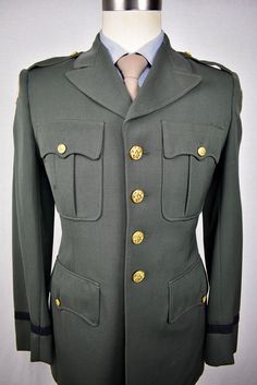 "http://revive-clothiers.com/products/4290 Free Shipping on All Domestic Orders! Internal Sku: 21828 Product Details: Manufacturer Country:United States Manufacturer Date:1950-60's Brand:US Army Retailer:Slavin Uniform CO. Color:Dark Green Weave:Worsted Pattern:Solid Composition:Wool / Poly Blend? Number Of Buttons:Four Button Stance:High Lapel Style:Peak Vents:Single Lining:Partial Number Of Buttons (Cuff):Zero Pocket Style:Flap Trouser Style:Plain Front Belt Loops:Yes Brace Buttons:No Tab Adju Military Style Fitted Uniform For Formal Occasions, Fitted Military Formal Uniforms, Fitted Military Uniform For Formal Occasions, Formal Fitted Uniform With Long Sleeves, Formal Fitted Long Sleeve Uniform, Fitted Long-sleeved Military Uniforms, Fitted Long Sleeve Military Uniforms, Imperial Clothing, Trouser Style