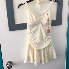 This Adorable 1 Piece Halter Top Swimsuit Has Never Been Worn! Gathered Around The Tummy Making It Flattering To Your Figure With A Flowing Skirt Over. The Sizing On The Tag Is A Chinese Xl (Thus The Reason It’s Never Been Worn) The Size Would Be Similar To A Small! My Loss Is Your Gain! Cream Swimwear For Summer, White One-piece Tankini For Spring, White Fitted Tankini For Beach Season, Fitted Cream Swimwear For Spring, Cream Sleeveless Swimwear For Beach, Cream Fitted Swimwear For Spring, Summer Halter Neck Fitted Bodysuit, Cream Sleeveless Swimwear For Summer, Fitted One-piece Cream Swimwear