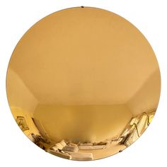 a round mirror reflecting the inside of a room