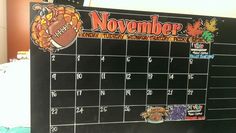 a blackboard calendar with an image of a turkey on it and the words november written in large letters