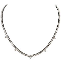 Diamond Straight Line Necklace in 18k 5 Round Brilliant Cut Diamonds weighing .40 carats approximately One Hundred and Forty Round Brilliant Cut Diamonds weighing 7.21 carats 7.61 carats in total diamond weight approximately [all Diamonds GH - VVS-VS2] Very Nice Quality. The bottom has a hook that allows for a multitude of drops that can be attached. This Gives The Wearer Unlimited Options Diamond White Platinum Necklace With Rose Cut Diamonds, Platinum Diamond Necklace With Rose Cut Diamonds, Luxury Diamond Tennis Necklace With 17 Jewels, Formal White Gold Diamond Necklace With Rose Cut, Luxury Platinum Necklace With Rose Cut Diamonds, Luxury Rose Cut Diamond Necklace In Platinum, Diamond White Necklace With Single Cut Diamonds For Evening, Platinum Necklaces With Diamond Accents, Pear-shaped, Dazzling Diamond Necklace With Accents For Evening