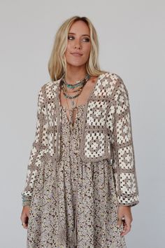 You'll feel at home in this comfy and effortless top, the Simply The Best Crochet Top is perfect to go with all your boho looks, including special events, time at the beach or just running around town, you'll get so many compliments! Pretty lightweight crochet fabric with colorful crochet square details Relaxed cardigan silhouette with a cropped length Classic open front closure with a self-tie tassel detail Relaxed long sleeves Pair with: Eye Of The Sun Padded Bralette, Sardinia Silky Tiered Ma Fall Crochet Top For A Day Out, Beige Crochet Top For Fall Vacation, Bohemian Crochet Top For Summer Layering, Fall Vacation Open Knit Crochet Top, Fall Crochet Open Knit Top For Vacation, Bohemian Crochet Lace Top For Spring, Bohemian Brown Crochet Top For Festival, Bohemian Spring Tops With Crochet Lace, Hippie Crochet Top For Fall