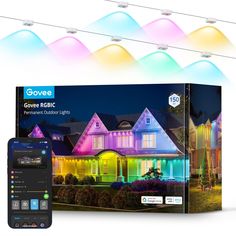 an image of some colorful lights in front of a house