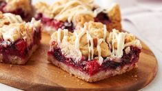 a wooden cutting board topped with pieces of pie