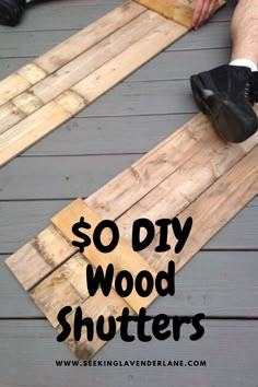 a person sitting on top of a wooden floor with the words $ 10 diy wood shutters