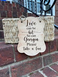 a sign on the side of a brick building that says love can be not so large, georgia please take a few