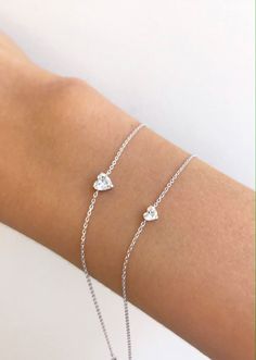 Sweet and simple with an extra special bit of love. Small solitaire heart is .21 ctw Large solitaire heart is .46 ctw Luxury Brilliant Cut Heart Bracelet, Bracelets For Girls, Mother Daughter Jewelry, Woman Accessories, Bangle Ring, Jewelry Bracelets Gold, Jewelry Accessories Ideas, Heart Chain, White Gold Jewelry