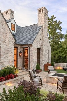 an outdoor patio with seating and fire pit