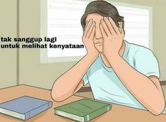 a man sitting at a desk covering his face with both hands while looking at a book