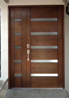 a modern wooden door with glass panels