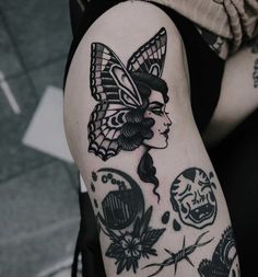 a woman's arm with tattoos on it, including a butterfly and other things