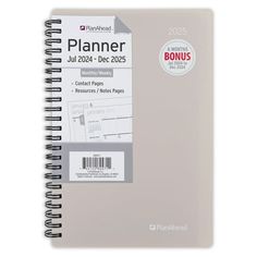 a spiral bound planner is shown on a white background