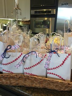 some bags with baseballs on them are sitting in the middle of a kitchen counter