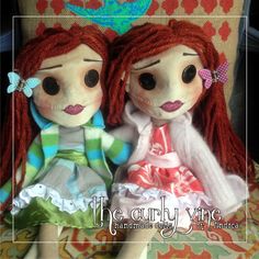 two dolls are sitting next to each other on a chair with the caption, the curlyie vine