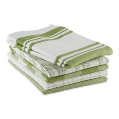 four green and white towels stacked on top of each other