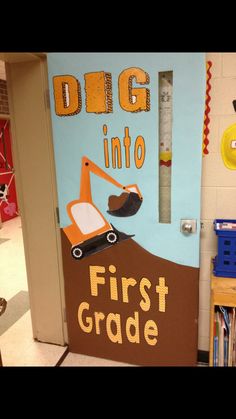 a door decorated to look like a construction site with the words dig into first grade written on it