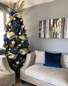 a living room with a christmas tree and couches