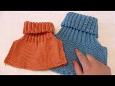 two knitted mittens sitting next to each other