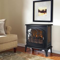 a living room with a couch, chair and fire place on the floor in it