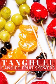 an assortment of fruit skewers with text overlay that reads, tangiuu candied fruit skewers