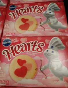 two boxes of hearts shaped cookies on top of each other