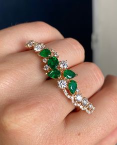 DETAILS Emerald Weight: 2.25 CT Diamond Weight: 1.42 CT Metal: 18K Rose Gold Ring Size: 6.5 / 8.5 Shape: Pear + Oval Color: Green Hardness: 7.5-8 Birthstone: May CUSTOM ORDER We customize high jewelry made with quality gemstones and diamonds. Please allow custom order 1-2 weeks.  * Extensive collection of colored gemstones for you to choose from - Emerald, Ruby, Sapphire, Alexandrite (+ some collection of semi precious) * CAD - any 3D design  * Made in USA SHIPPING All items will be shipped in safe and protective packaging within 1 day including tracking.  Please contact for more details about our products or custom orders!  EMERALD BIRTHSTONE The May birthstone, Emerald, was dedicated to Venus, the goddess of love and beauty. It promotes unconditional love and balance between partners. Th Emerald Finger Ring Gold, 2 Finger Ring, Two Finger Ring, Double Finger Ring, Gold Finger Rings, Smaragd Ring, Hand Rings, Emerald Birthstone, Colored Gemstones